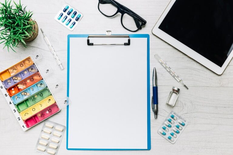 Clipboard with a weekly pill organiser and blister packs